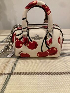 Coach Mini Rowan Bag Charm With A Cherry Print